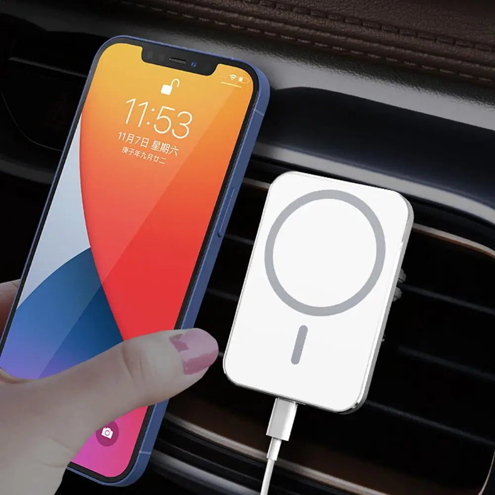 MagSafe car charger holding iPhone wirelessly charging