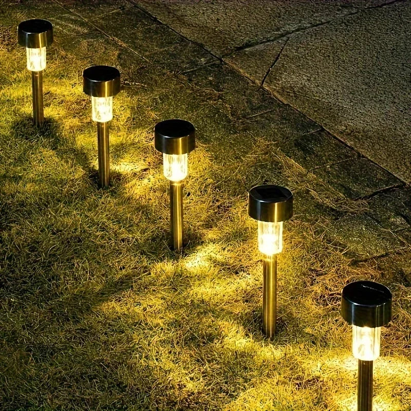 Solar LED path light stake installation in lawn
