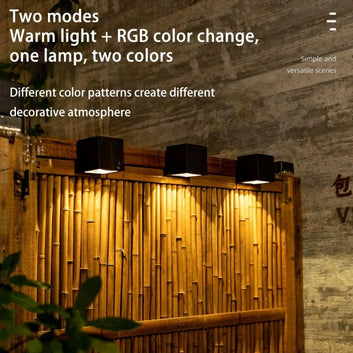 Solar wall lamp glowing on garden fence at night